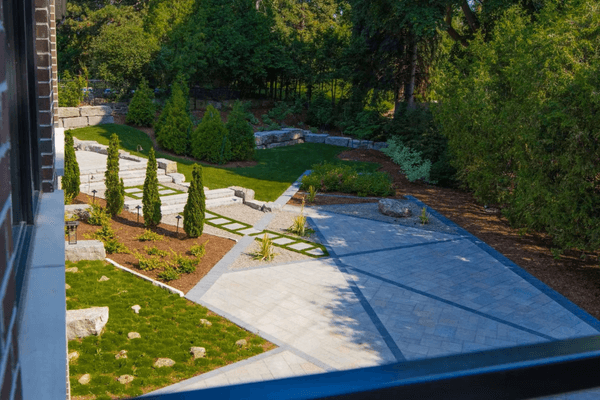 A photo of a custom walkway and patio designed by Kerr & Kerr landscaping.