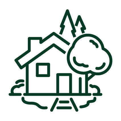 This is an icon depicting a stylized house with a gable roof, alongside two trees and two lines beneath to indicate the ground level. It's simple and monochromatic.