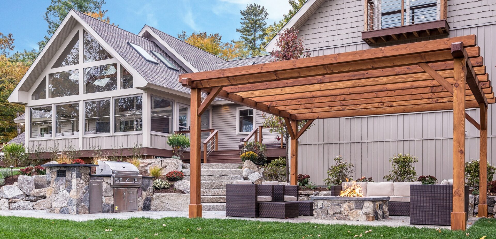 Pergola ideas using a wooden structure in a back yard.
